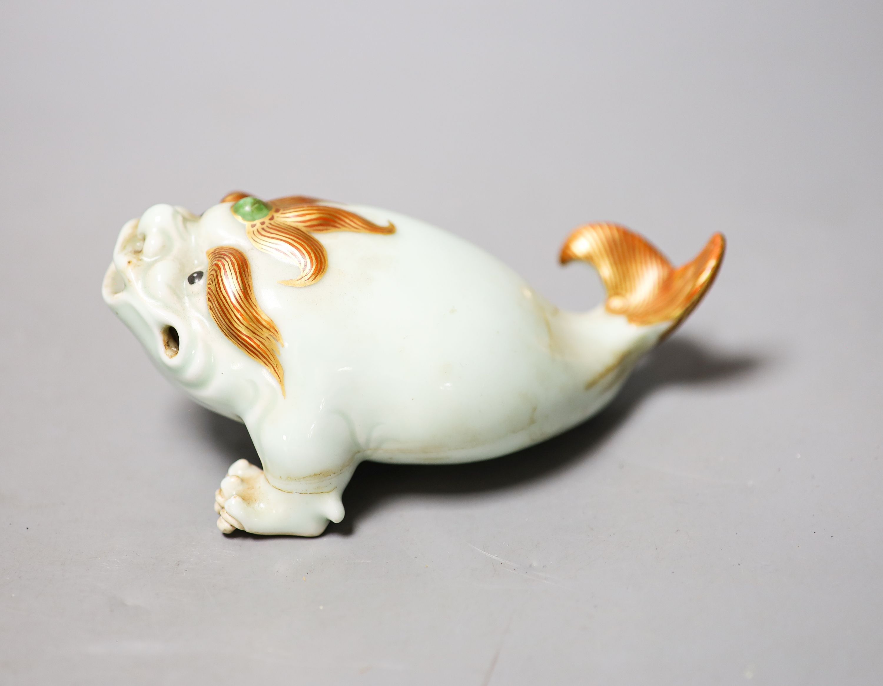 A Chinese celadon glazed model of a mythical creature, 13.5cm